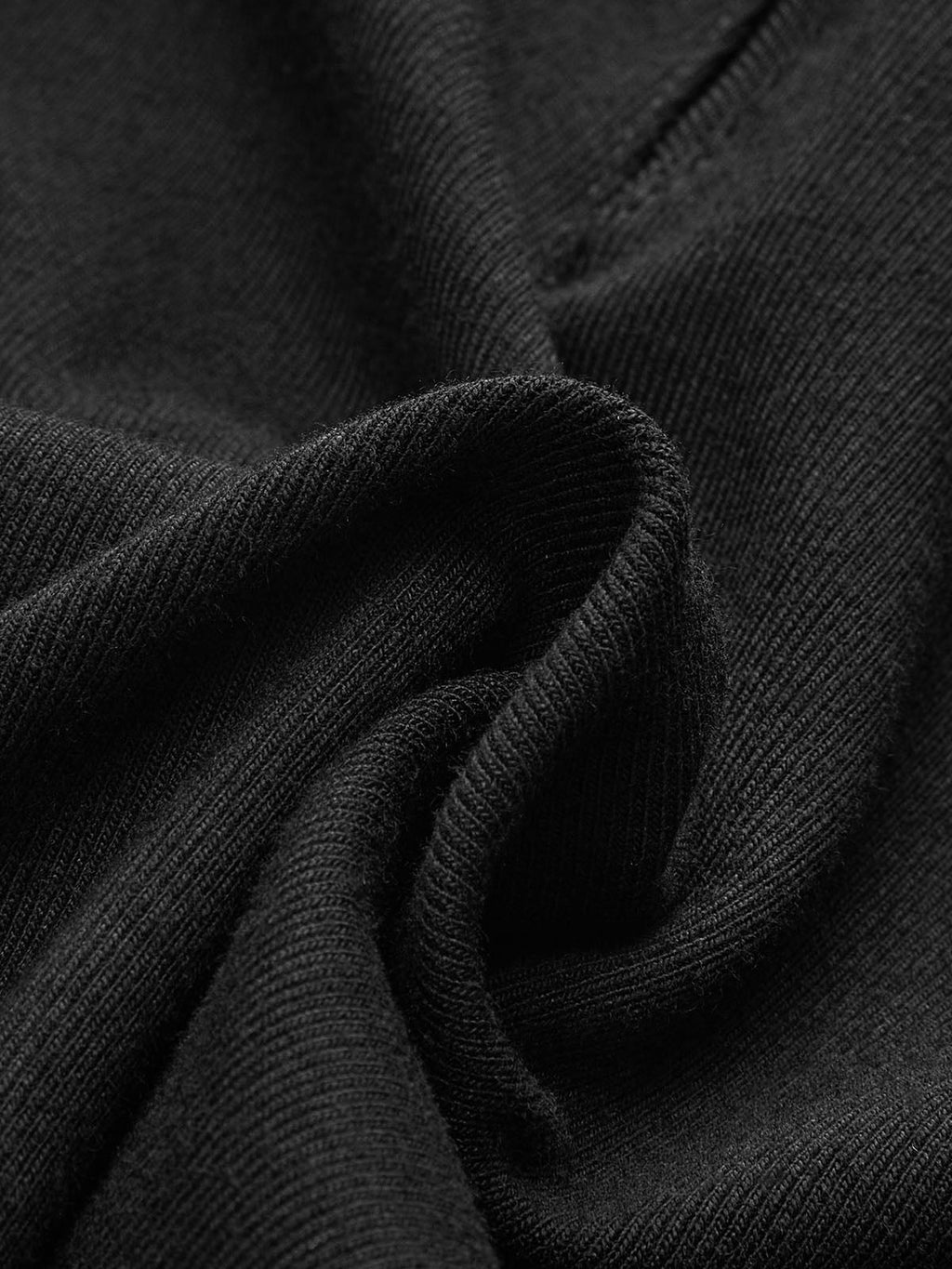 Sheer crew neck bodysuit with smooth, subtly ribbed texture, gentle folds, and wavy creases.