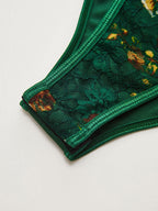 Floral embroidered bustier corset bodysuit with green lace details and elegant structure.