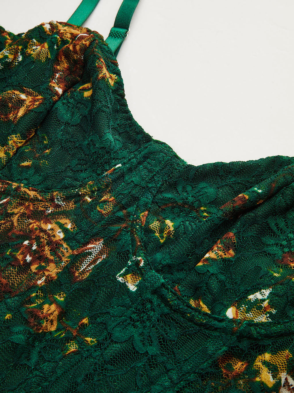 Dark green lace bustier corset bodysuit with brown and yellow floral embroidery.