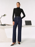 Black turtleneck paired with LA FINE FLEUR Mid-Rise Jeans featuring chic side slits.