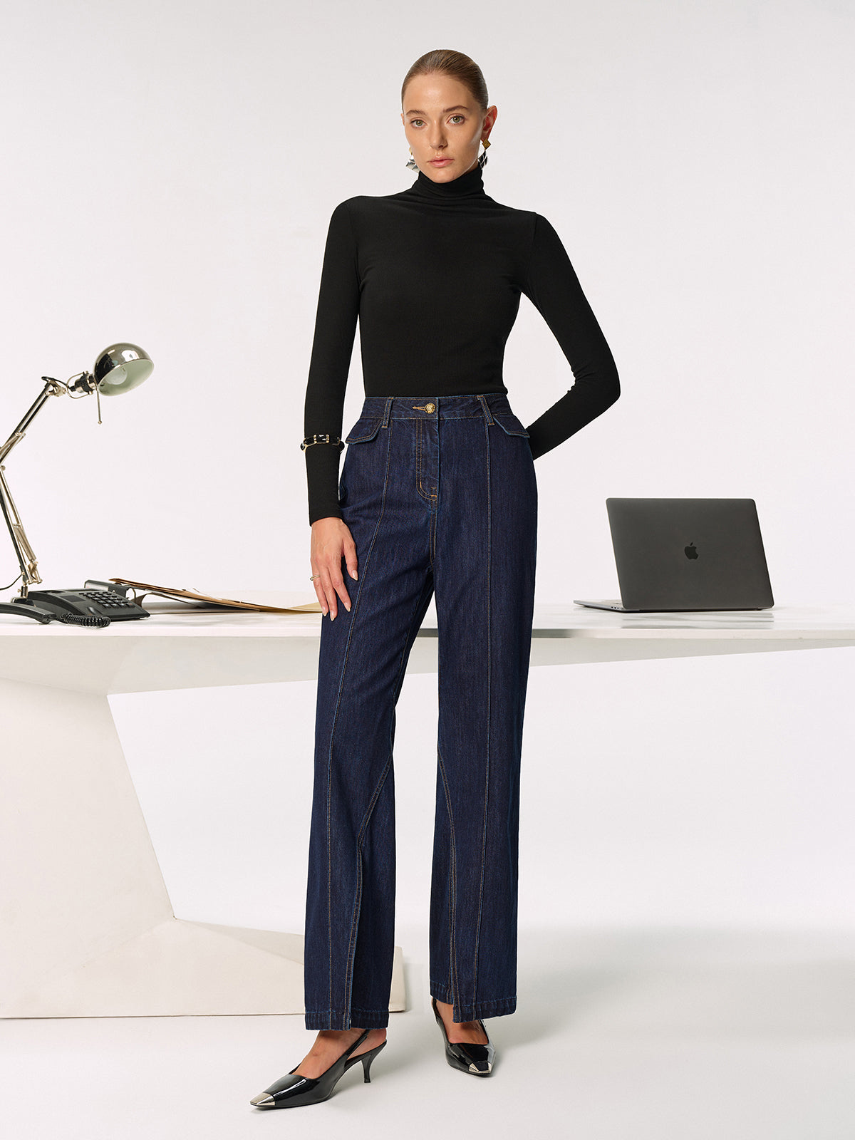 Black turtleneck paired with LA FINE FLEUR Mid-Rise Jeans featuring chic side slits.