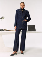 LA FINE FLEUR mid-rise jeans with side slits, black turtleneck, and black heels.
