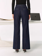 LA FINE FLEUR’s mid-rise jeans with chic side slits, paired with black heels.