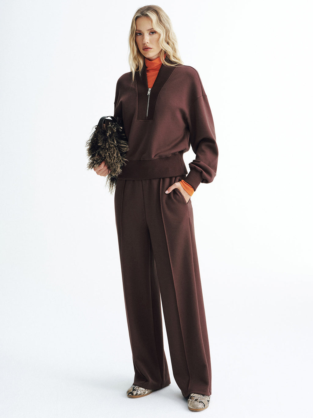 Dark brown V-Neck Half-Zip Cozy Pullover Sweatshirt with matching wide-leg pants and orange turtleneck.