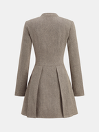 Plaid snap button mini dress with long sleeves, fitted waist, pleated skirt, stand collar.