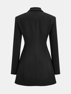 Tailored blazer dress with buttoned collar, long sleeves, fitted waist, and flared hem.
