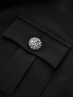 Black tailored blazer dress featuring a pocket with flap and silver decorative button detail.