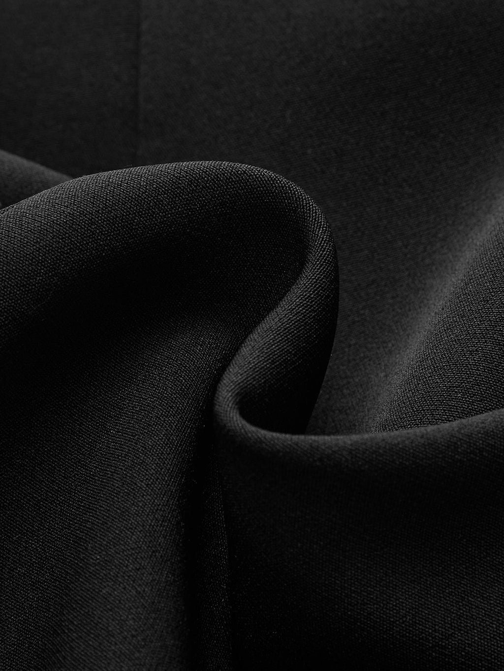 Tailored blazer dress in matte black fabric with soft folds and buttoned collar detail.