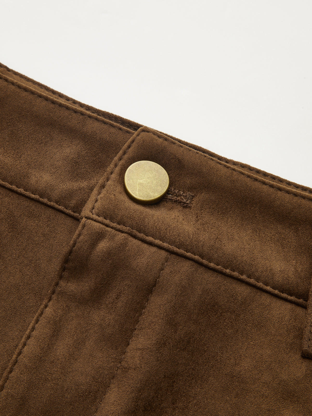 Waistband of LA FINE FLEUR suede-style long skirt with sheer mesh, brass button, visible stitching.
