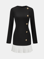 Black long-sleeve mini dress with gold buttons and a white pleated skirt accent.