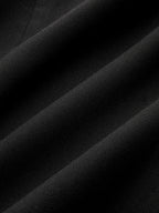 Asymmetric mini dress with black woven polyester, pleated hem, and striking metal detail.