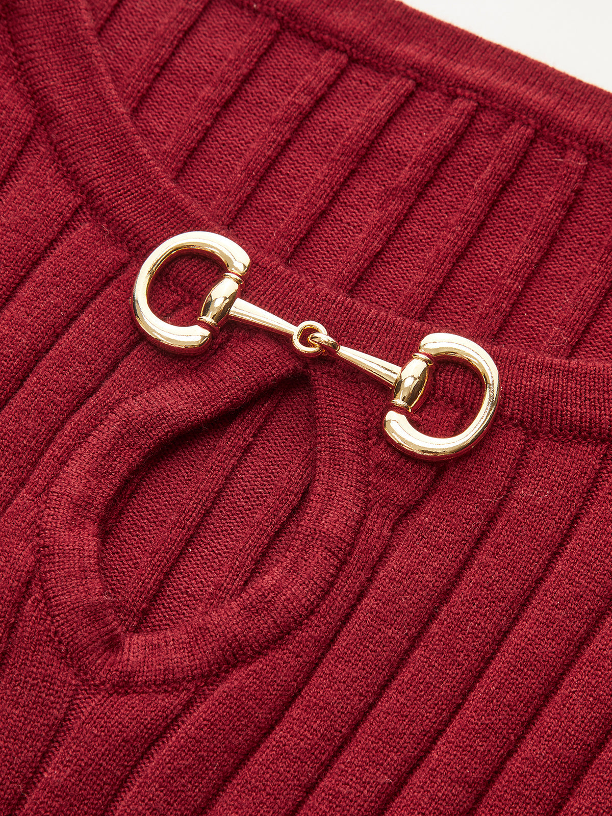 Bell sleeve midi dress in ribbed red knit with mermaid hem and gold horsebit detail.