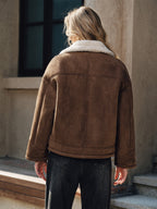 A stylish lapel coat with cozy fleece lining paired with dark jeans.