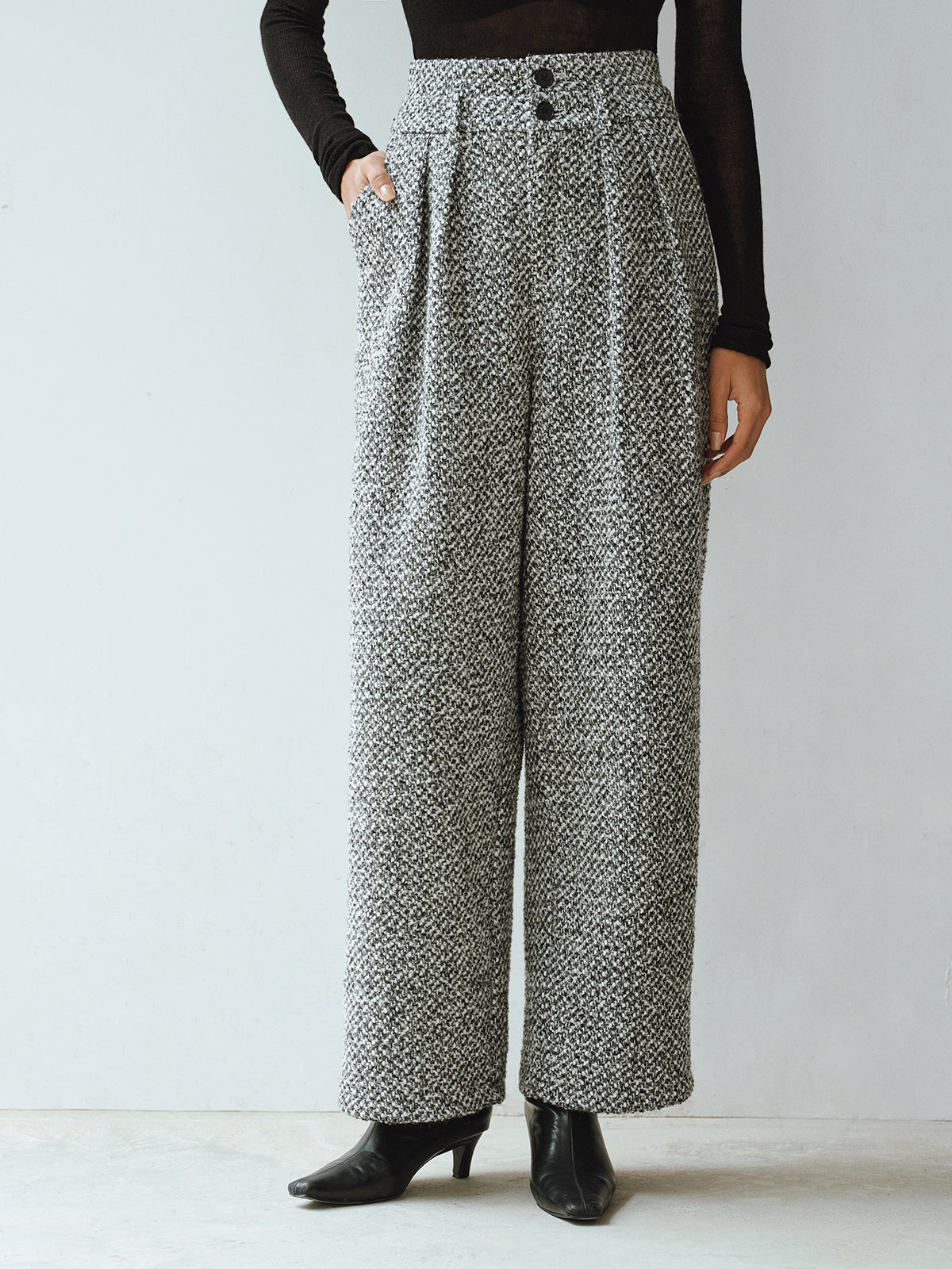 LA FINE FLEUR Double Waistband Wool Blend Tweed Trousers, black long-sleeve top, black heeled shoes.