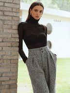 Sheer black turtleneck paired with LA FINE FLEUR Double Waistband wool blend tweed trousers.