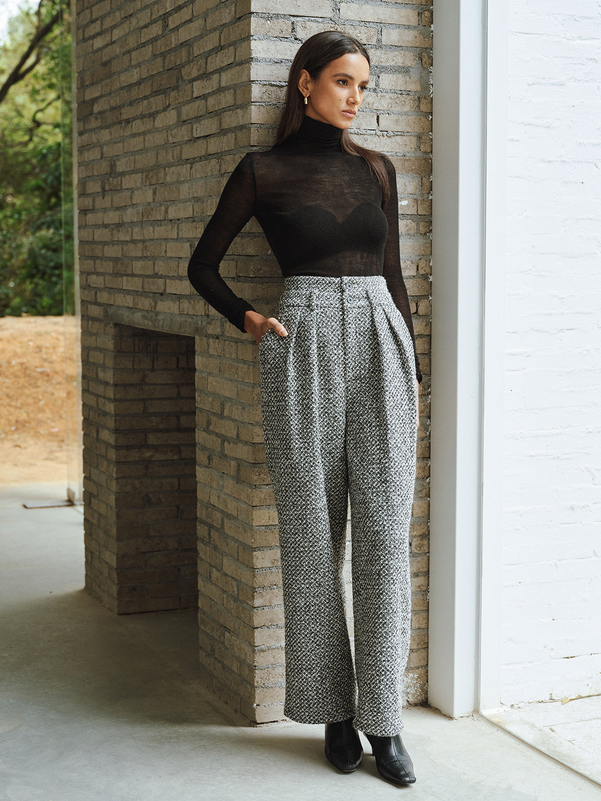 Sheer black turtleneck paired with LA FINE FLEUR tweed trousers and black shoes.