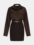 A ribbed knit shirt dress with long sleeves, collared neckline, and belted gold-buckle detail.