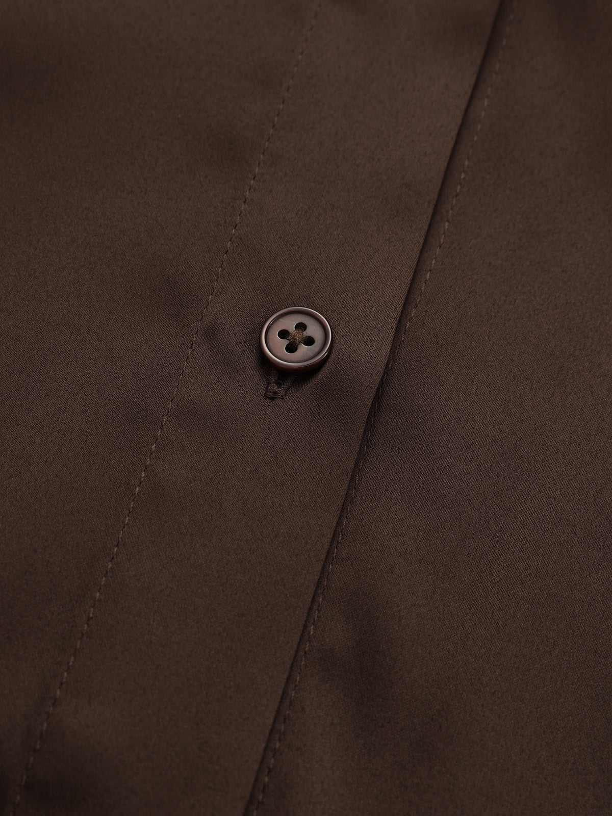 Ribbed knit shirt dress with brown collar, belted panel, and buttoned front detail.