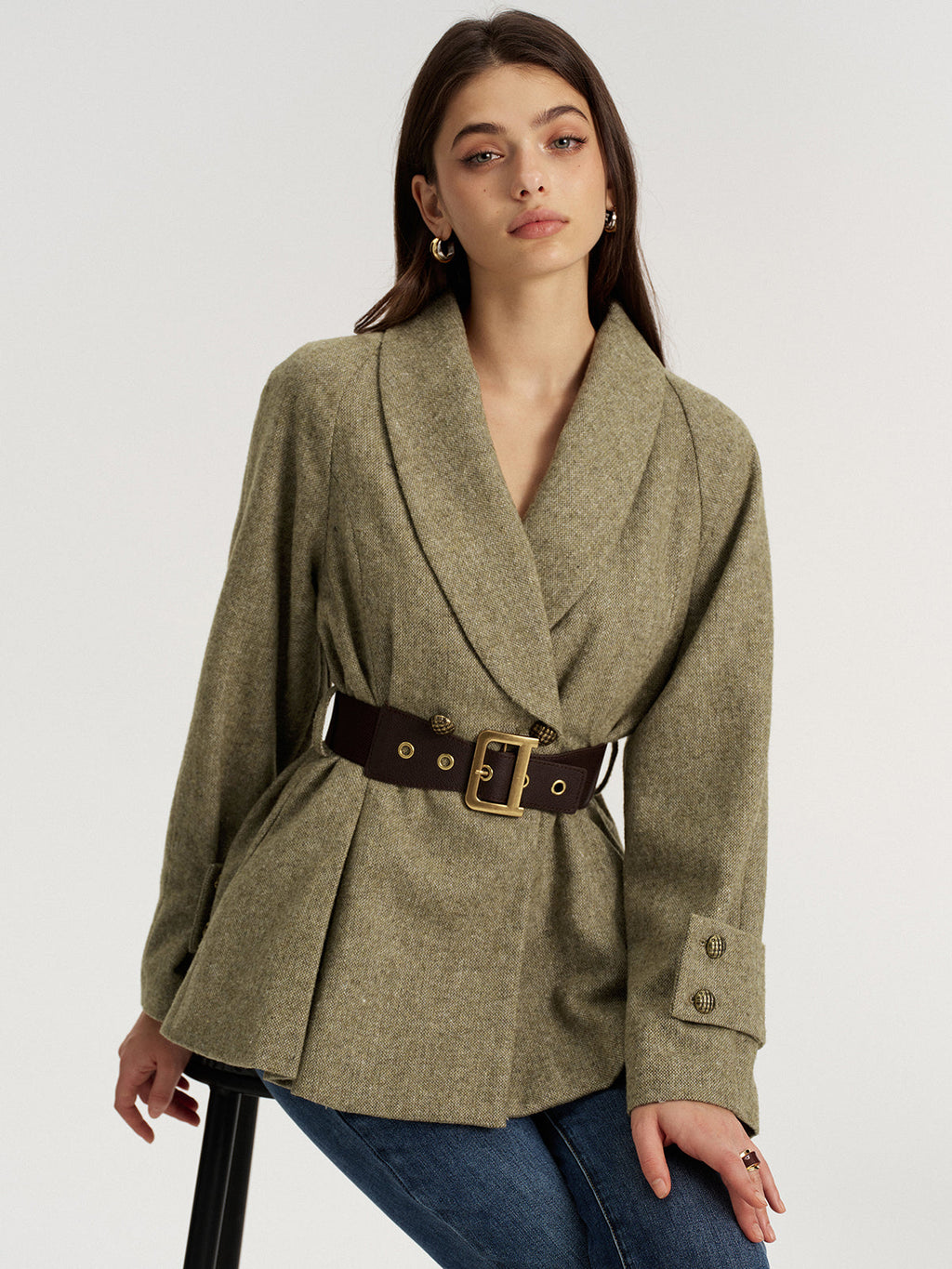 LA FINE FLEUR shawl collar wool-blend blazer, cinched at the waist with a gold-buckled dark brown belt.