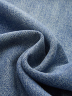 Wide-leg blue denim jeans featuring detailed woven cotton texture and natural color variations.