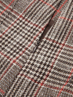 Brown, beige, and red checkered tweed shorts with belt loops and a zippered pocket.