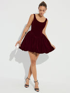 The LA FINE FLEUR Velvet Mini Dress with bubble hem and delicate straps.