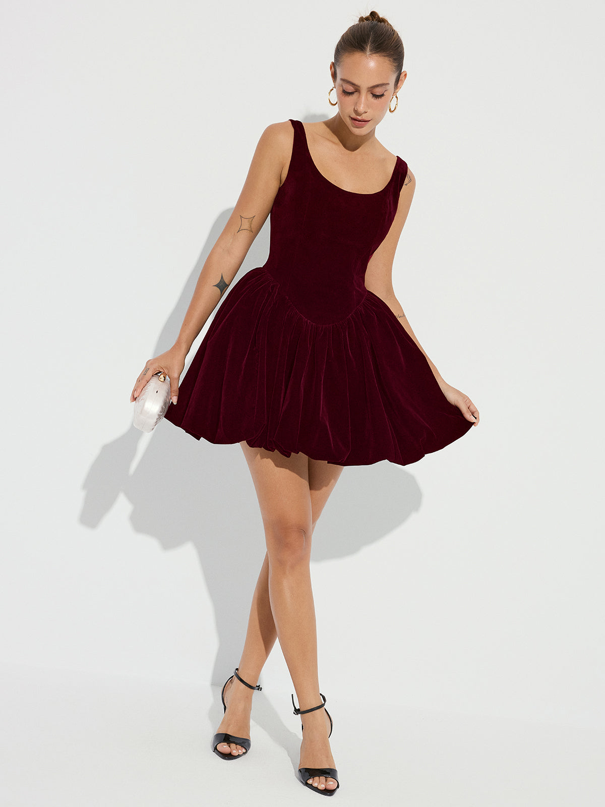 The LA FINE FLEUR Velvet Mini Dress with bubble hem and delicate straps.