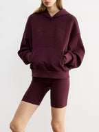 A burgundy LA FINE FLEUR Embroidered Letter Design Casual Hoodie with a front pocket.