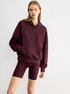 Maroon LA FINE FLEUR Embroidered Letter Design Casual Hoodie paired with matching bike shorts.