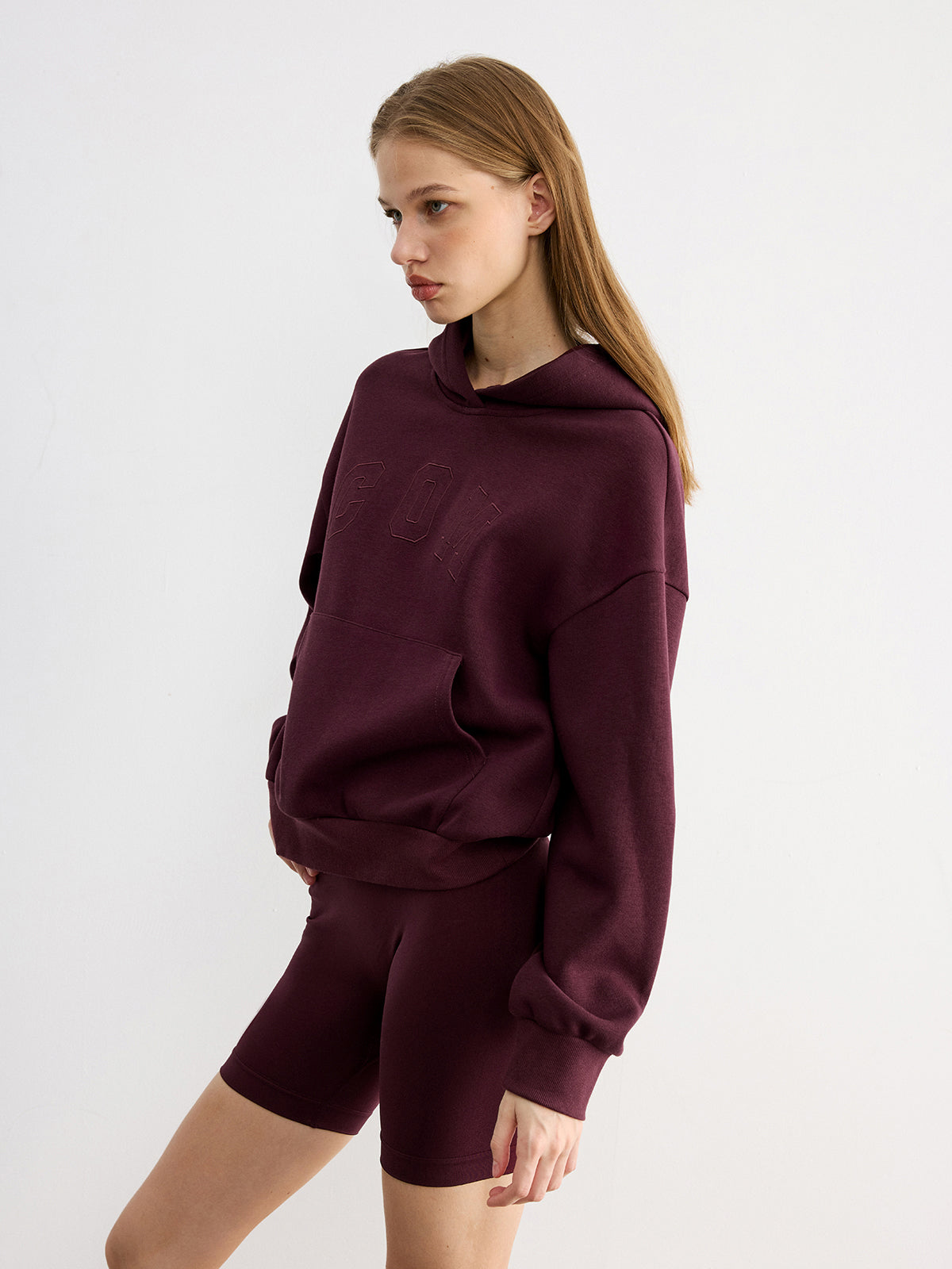 LA FINE FLEUR hoodie with embroidered letter design, featuring a casual fit and style.