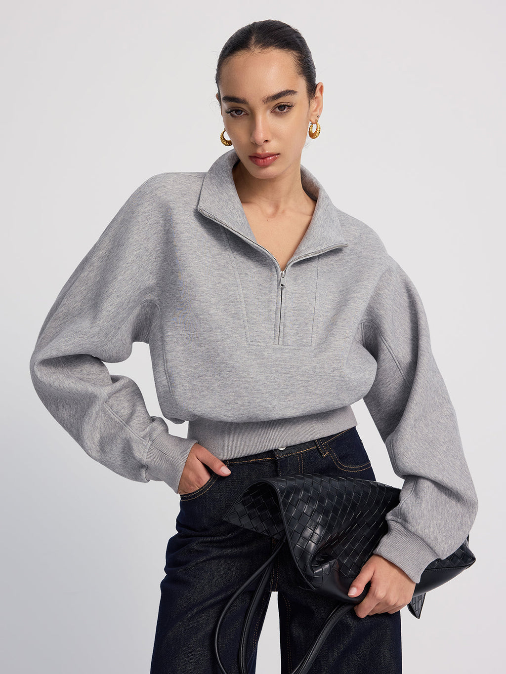 Grey heather LA FINE FLEUR Half-Zip Cropped Sweatshirt in an oversized fit, dark indigo jeans.