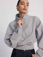 LA FINE FLEUR Half-Zip Cropped Sweatshirt in Oversized Fit paired with dark blue jeans.
