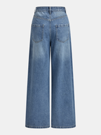 Light blue wide-leg jeans with mid-waist, asymmetric cut, back pockets, and distressed texture.