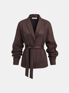 Brown suede-effect jacket with a shawl collar, belted waist, and cinched sleeves.