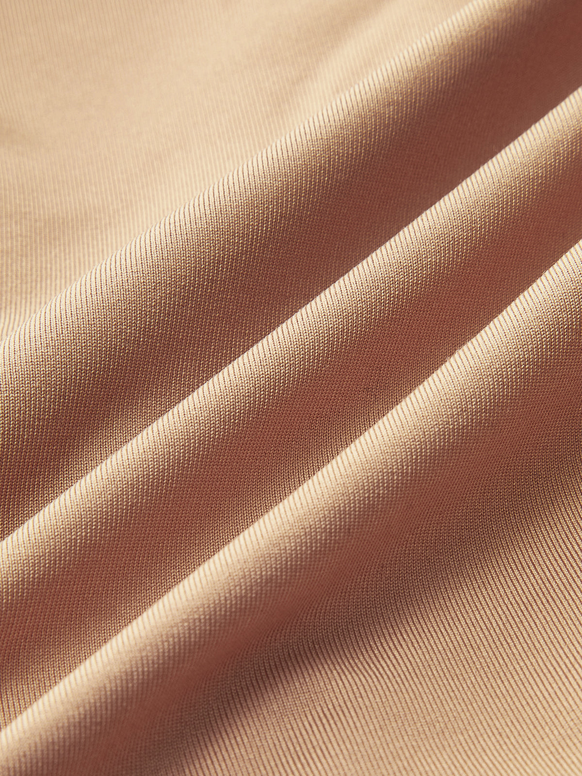 Light beige, fine ribbed Deep V-Neck Bodysuit with Buckle and long sleeves, softly folded.