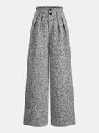 Gray and white tweed trousers with high waist, double waistband, front pleats, and wide legs.