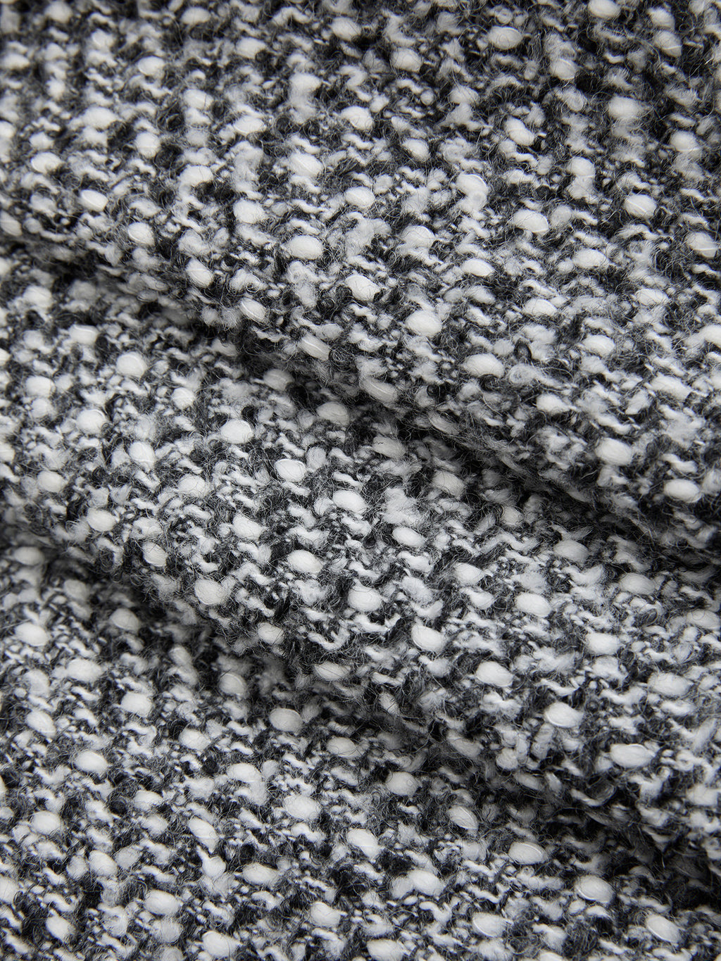Double waistband wool blend tweed trousers with black and white textured knit, bumpy woven pattern.