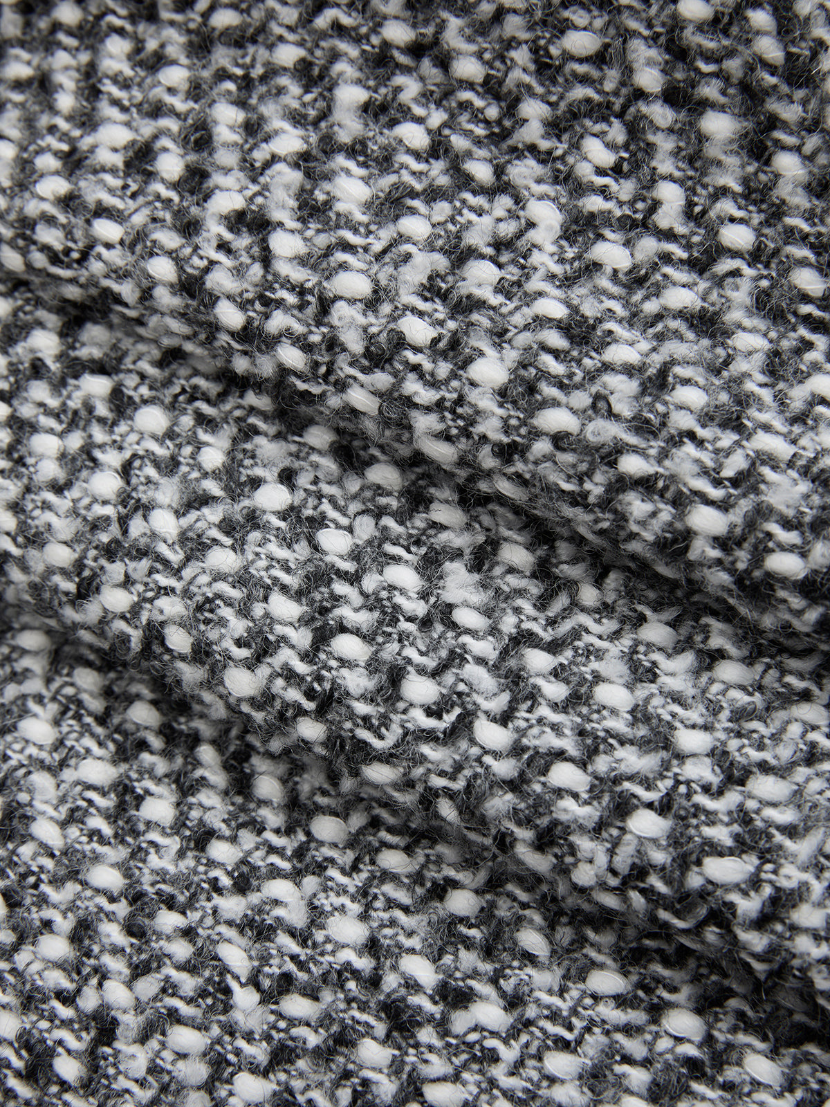 Double waistband wool blend tweed trousers with black and white textured knit, bumpy woven pattern.