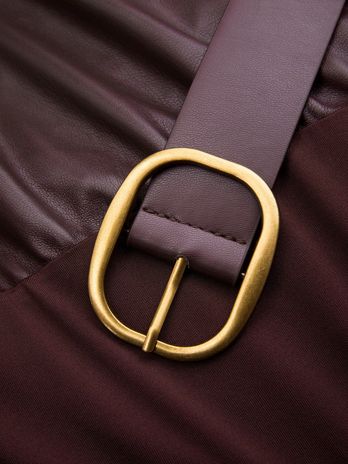A ruched sleeveless faux leather belted bodysuit styled with a classic brown leather belt.