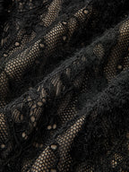 Black sheer lace bodysuit with floral and geometric patterns layered over beige fabric.