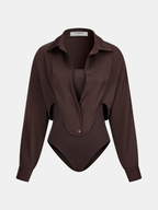 A dark brown satin panel shirt bodysuit with long sleeves, button front, and sleeveless base.