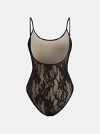 A backless cami bodysuit with semi-sheer floral lace, thin straps, and scoop neckline.