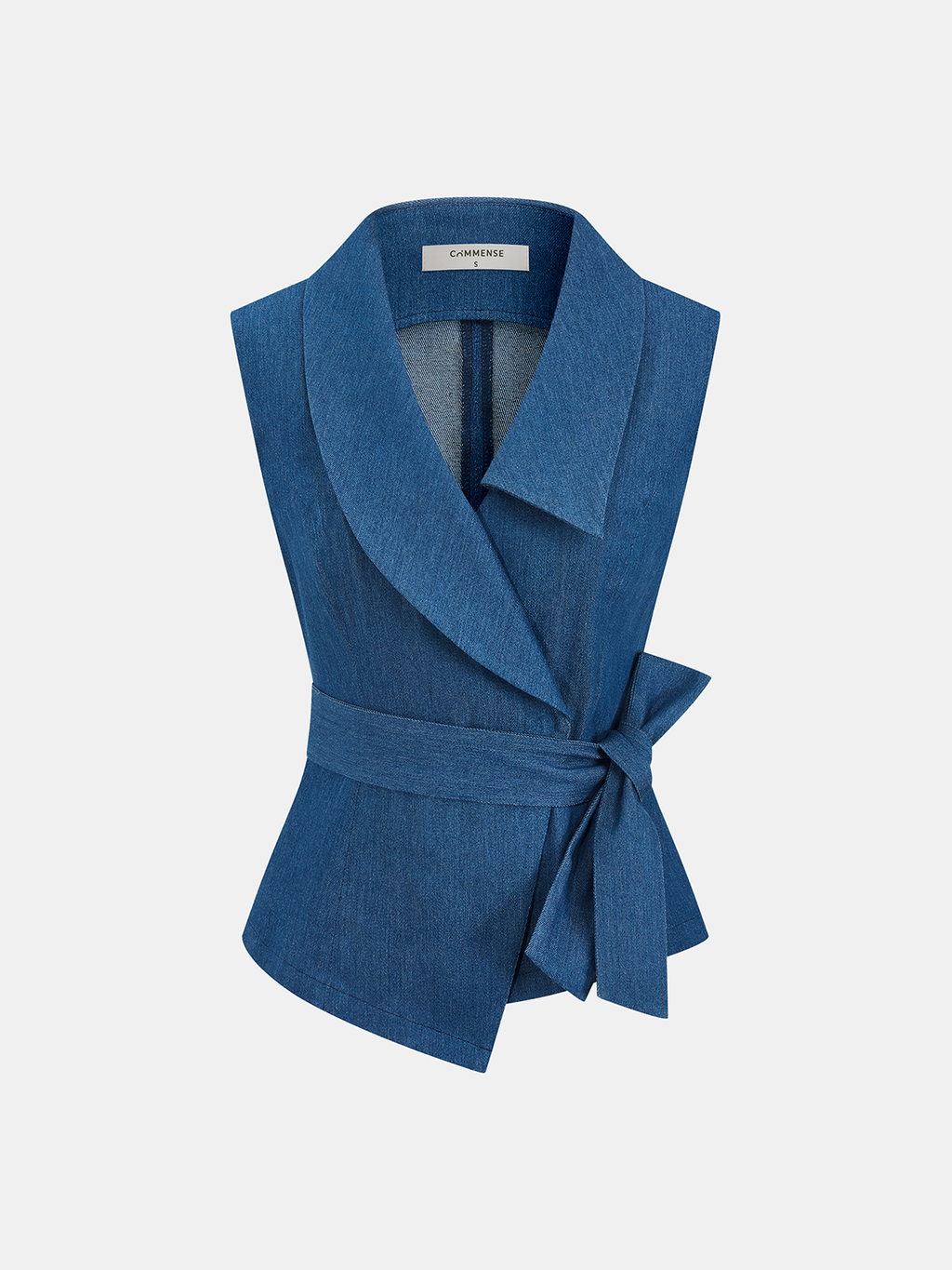 Sleeveless blue denim wrap vest with wide collar, asymmetrical cut, and adjustable tie waist.