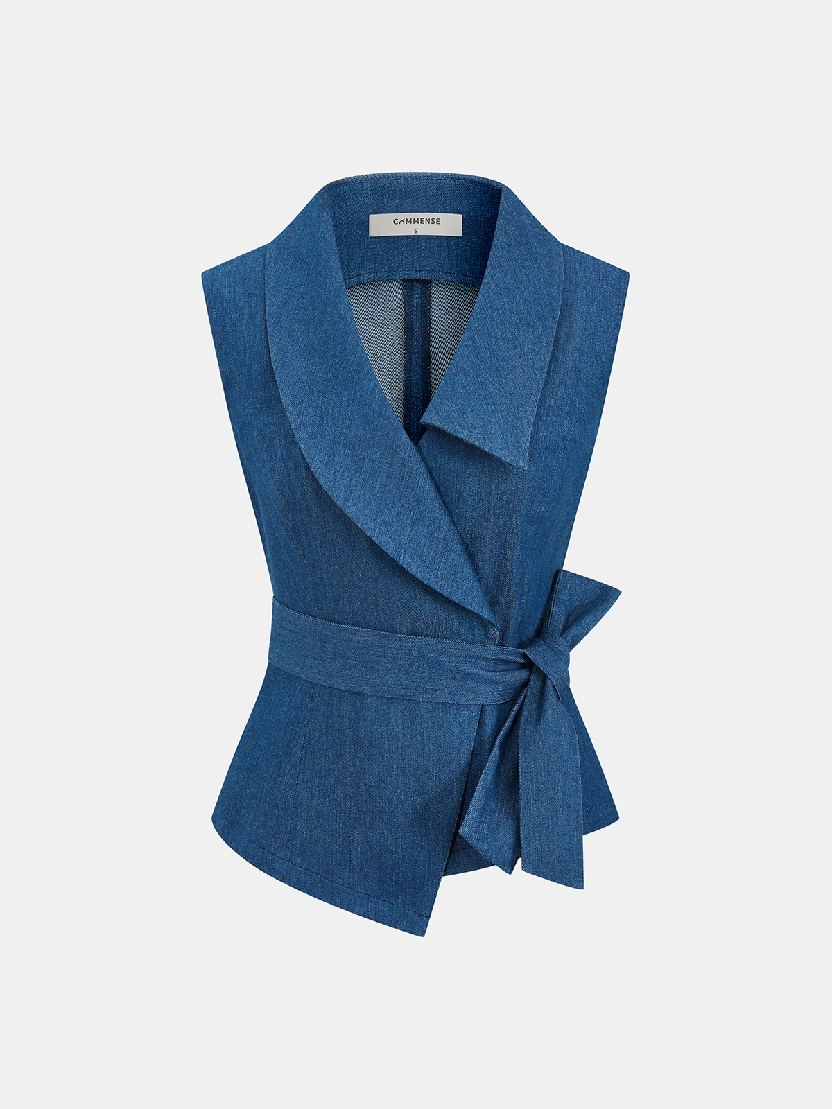 Sleeveless blue denim wrap vest with wide collar, asymmetrical cut, and adjustable tie waist.
