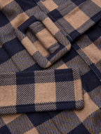 Plaid wide-leg jumpsuit with brown and navy checks, belted cami top, matching buckle.