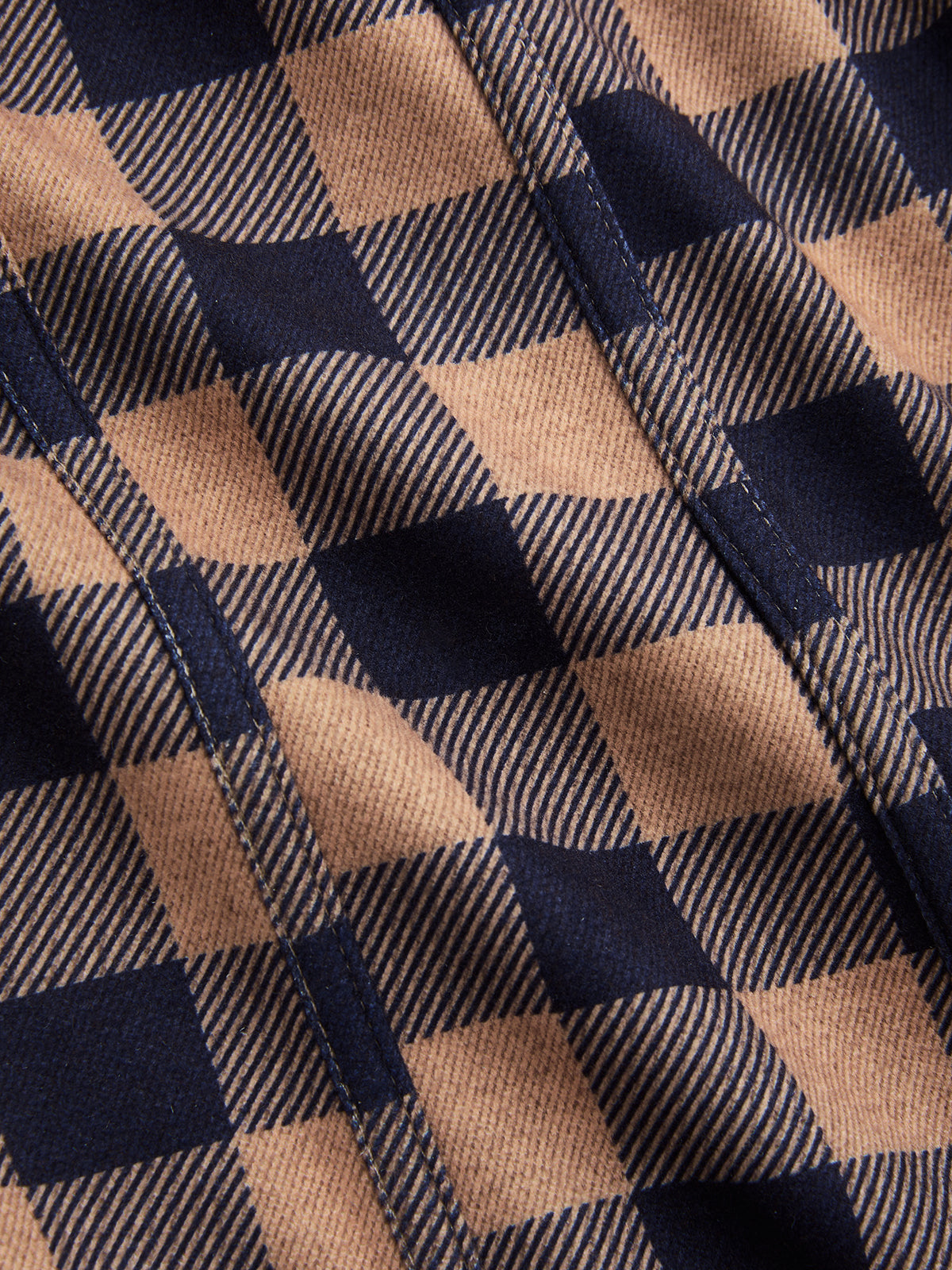Plaid wide-leg jumpsuit with belted cami top, brown and navy woven fabric, diagonal seams.