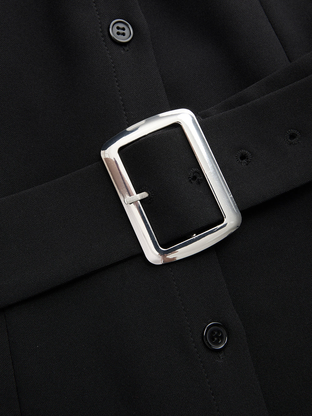 Sleeveless color block blouse with collar and black belt, silver rectangular buckle detail.