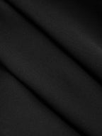 Close-up of black sleeveless blouse with collar, showing fine texture and soft diagonal folds.