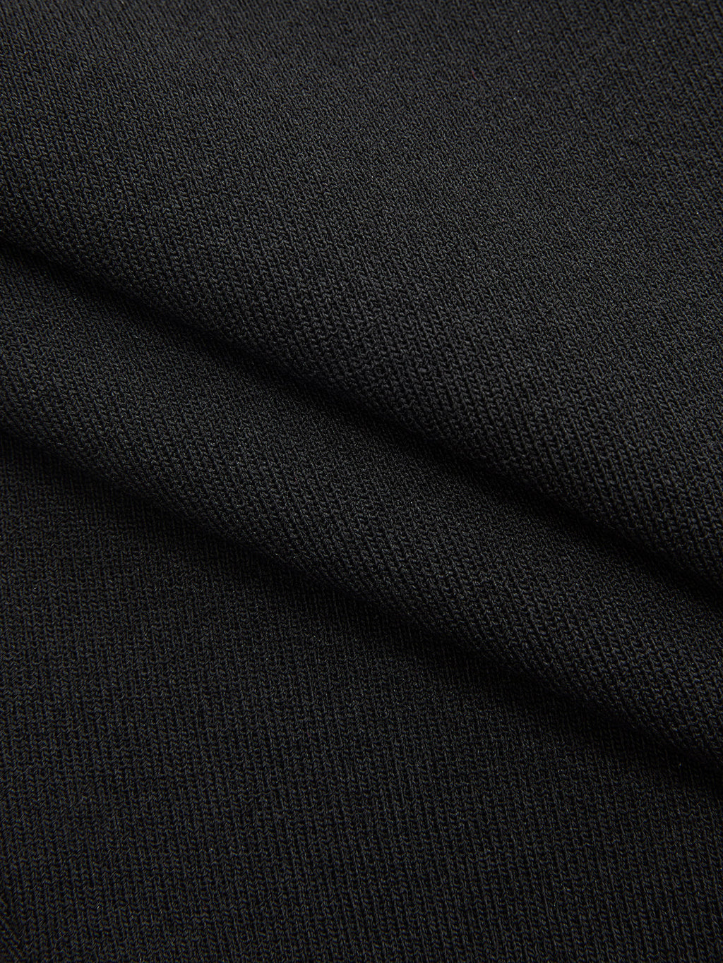 Black stretch-knit striped mock neck midi dress with diagonal ribbed texture and fine stitching.