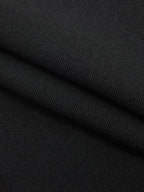 Black stretch-knit striped mock neck midi dress with diagonal ribbed texture and fine stitching.